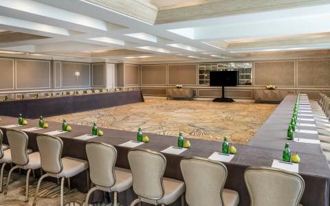 a room with a large table and chairs