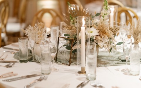 a table set with candles and flowers