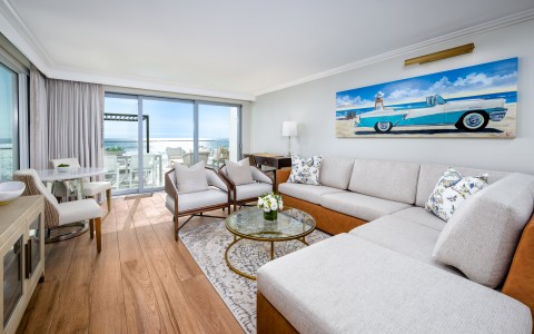 a living room with a large couch and chairs