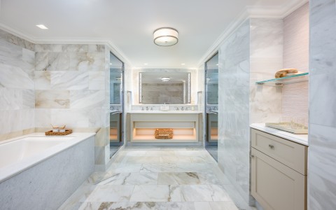 a bathroom with marble tiles