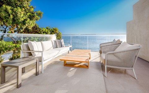 a patio with a table and chairs