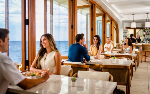 a group of people sitting at tables