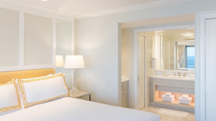 a bedroom with a bed and a sink