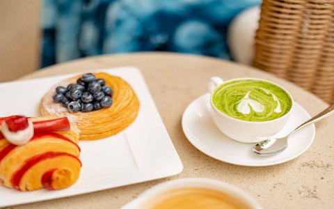 a plate of pastries and a cup of green tea