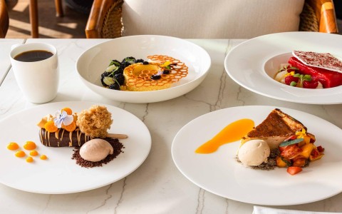 a table with plates of desserts