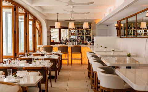 a restaurant with tables and chairs
