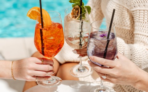 a group of people holding drinks