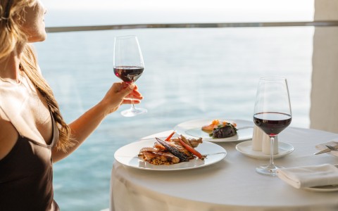 a woman holding a glass of wine