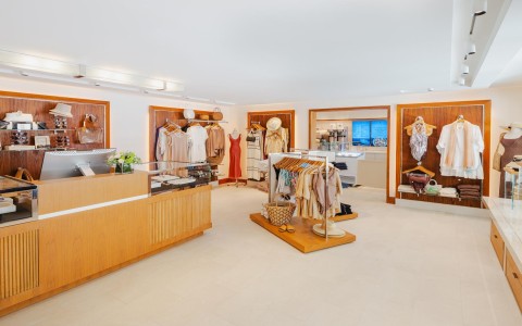 a store with clothes on swingers