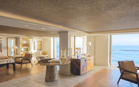 a room with a large window and a table
