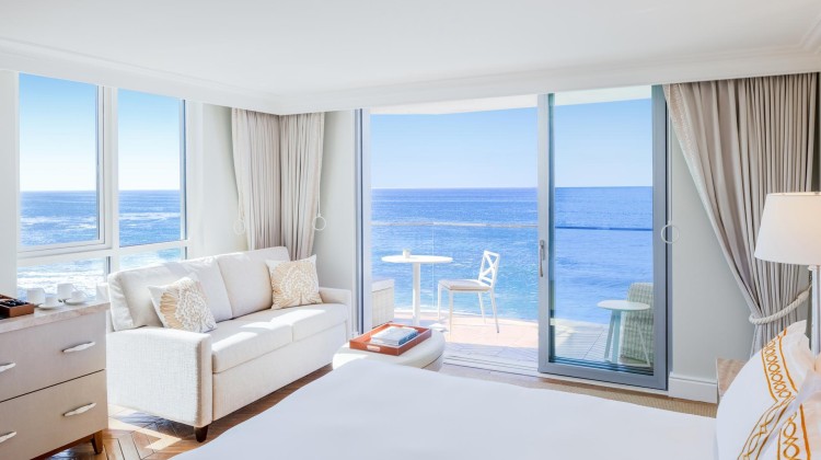 a room with a bed and a couch and a table with chairs and a table with chairs and a table with chairs and a table with chairs and a table with chairs and a table with chairs and