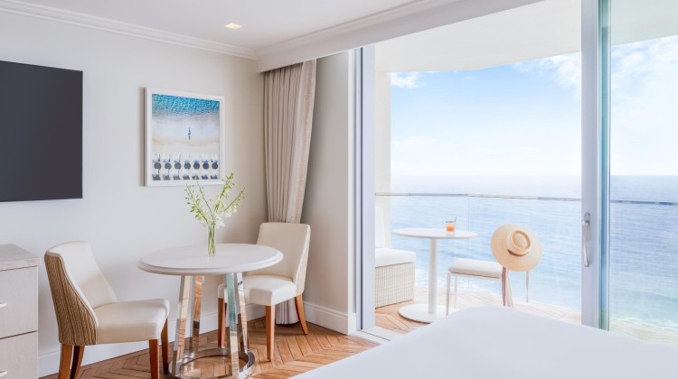 a room with a table and chairs and a table and a hat