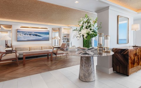 a room with a table and a vase of flowers