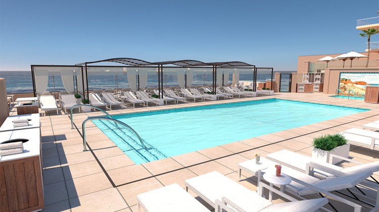 a pool with lounge chairs and a roof top