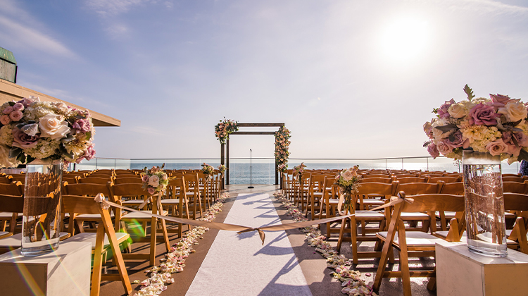 view of elegant wedding isle overlooking the ocean