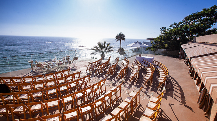 outdoor venue with lots of seating overlooking the ocean