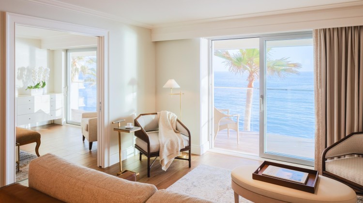 a living room with a view of the ocean