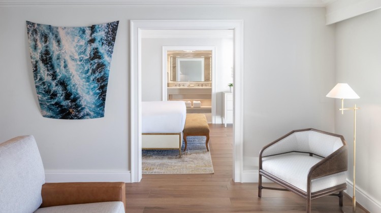 a room with a chair and a bed