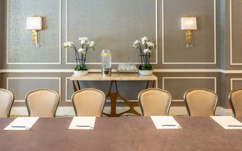 a table with chairs in a room