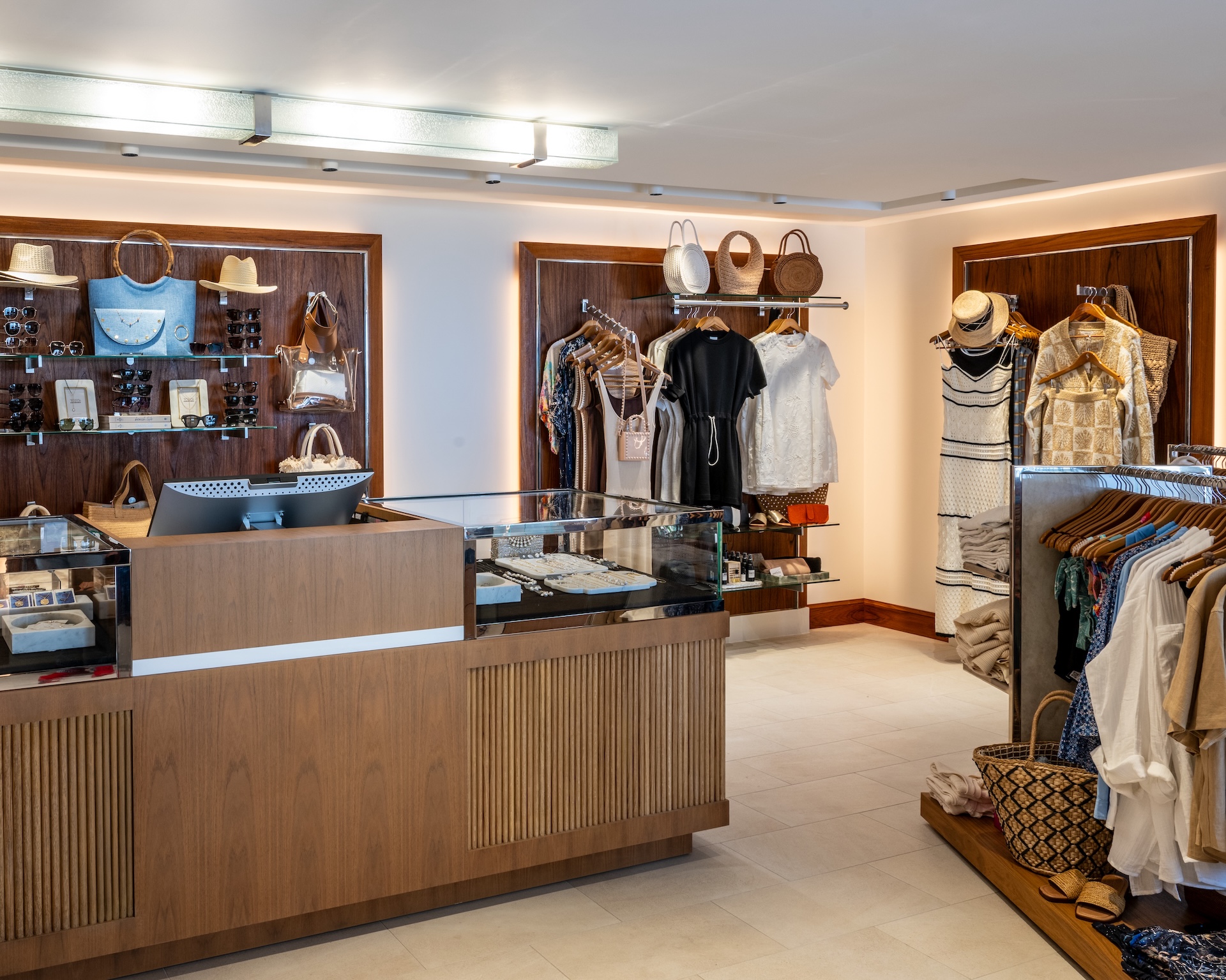 a store with a variety of clothes on swingers