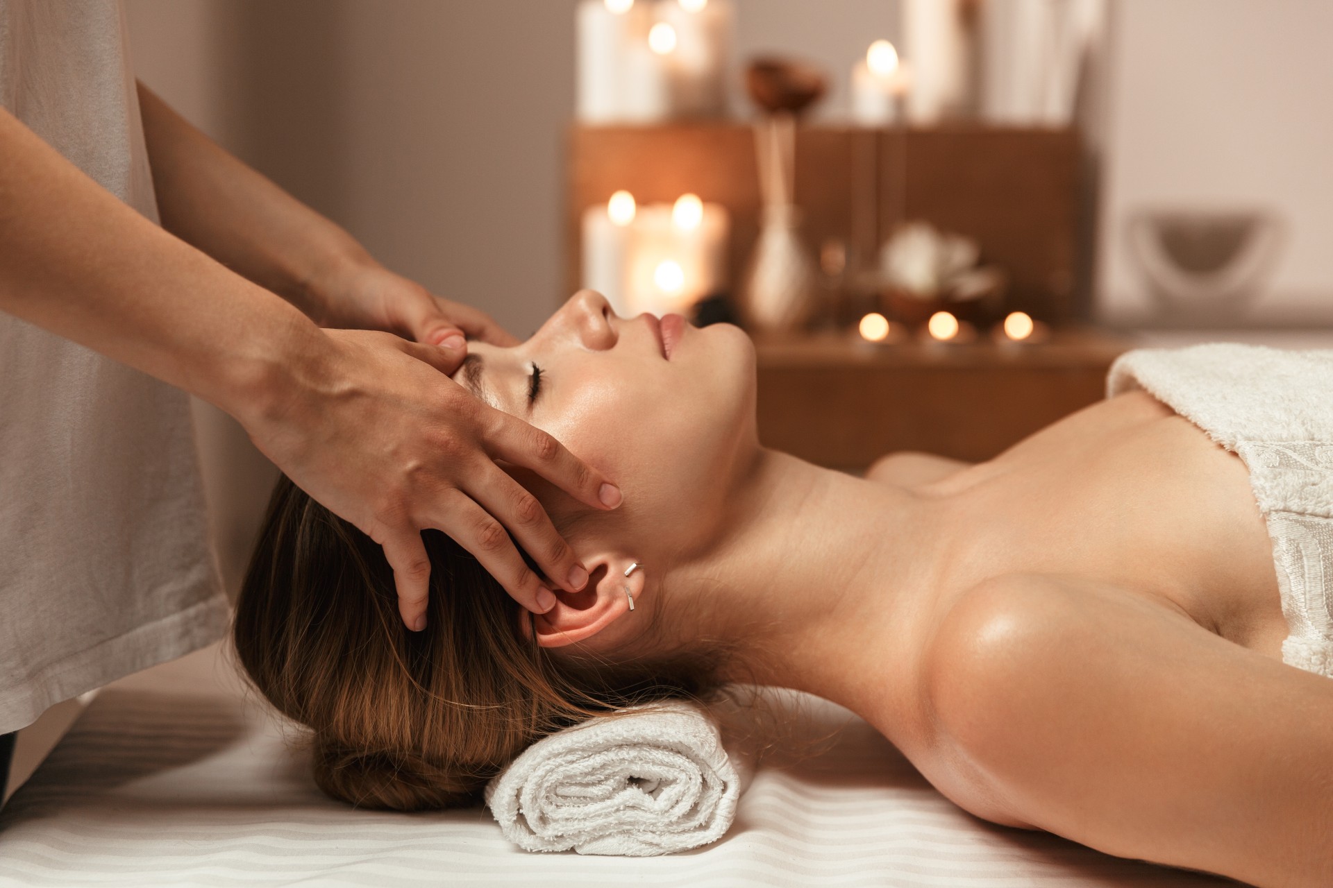 a woman lying down on a massage table