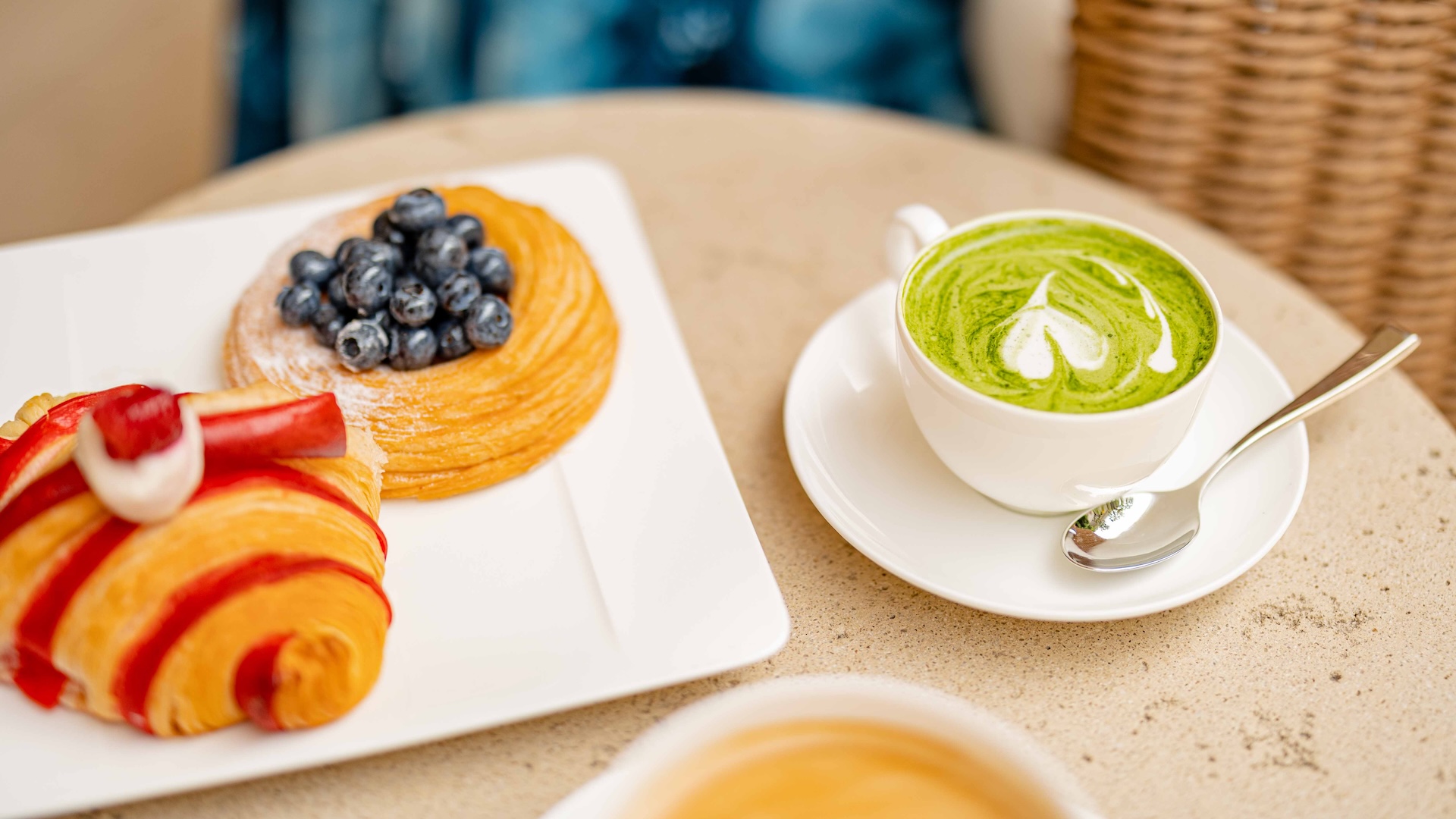 a plate of food and a cup of green tea