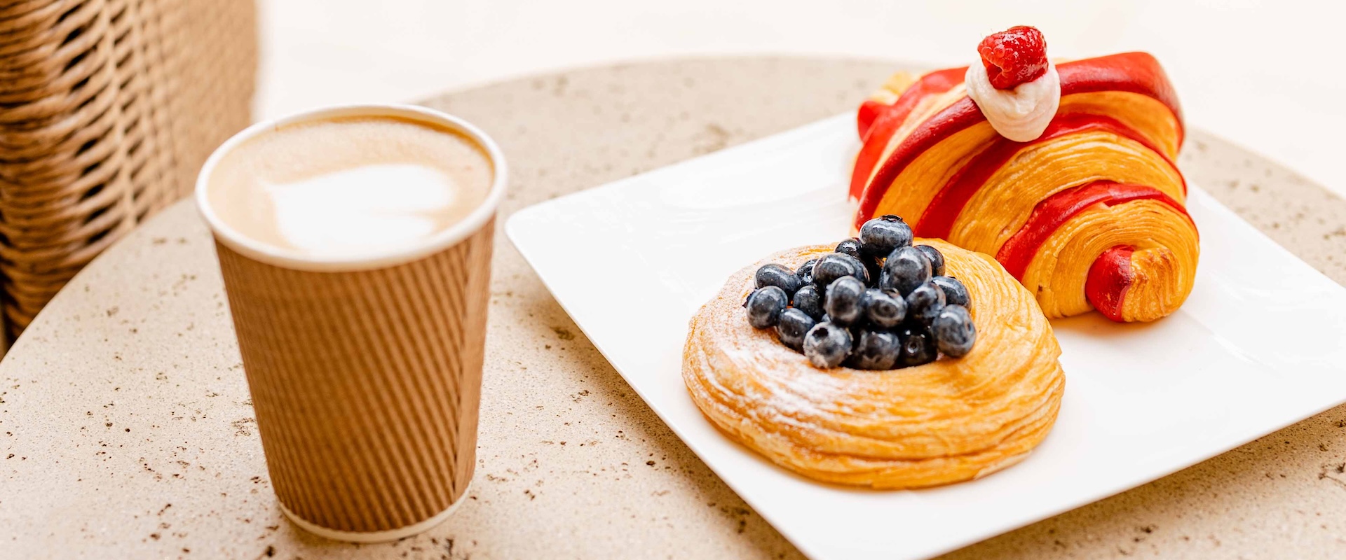 a plate of pastries and a cup of coffee