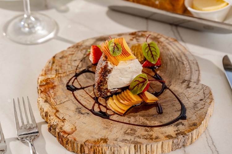 a piece of dessert on a wood slab