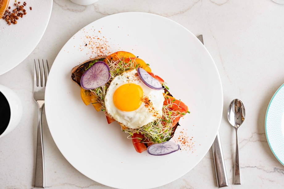 a plate of food with a fried egg on top