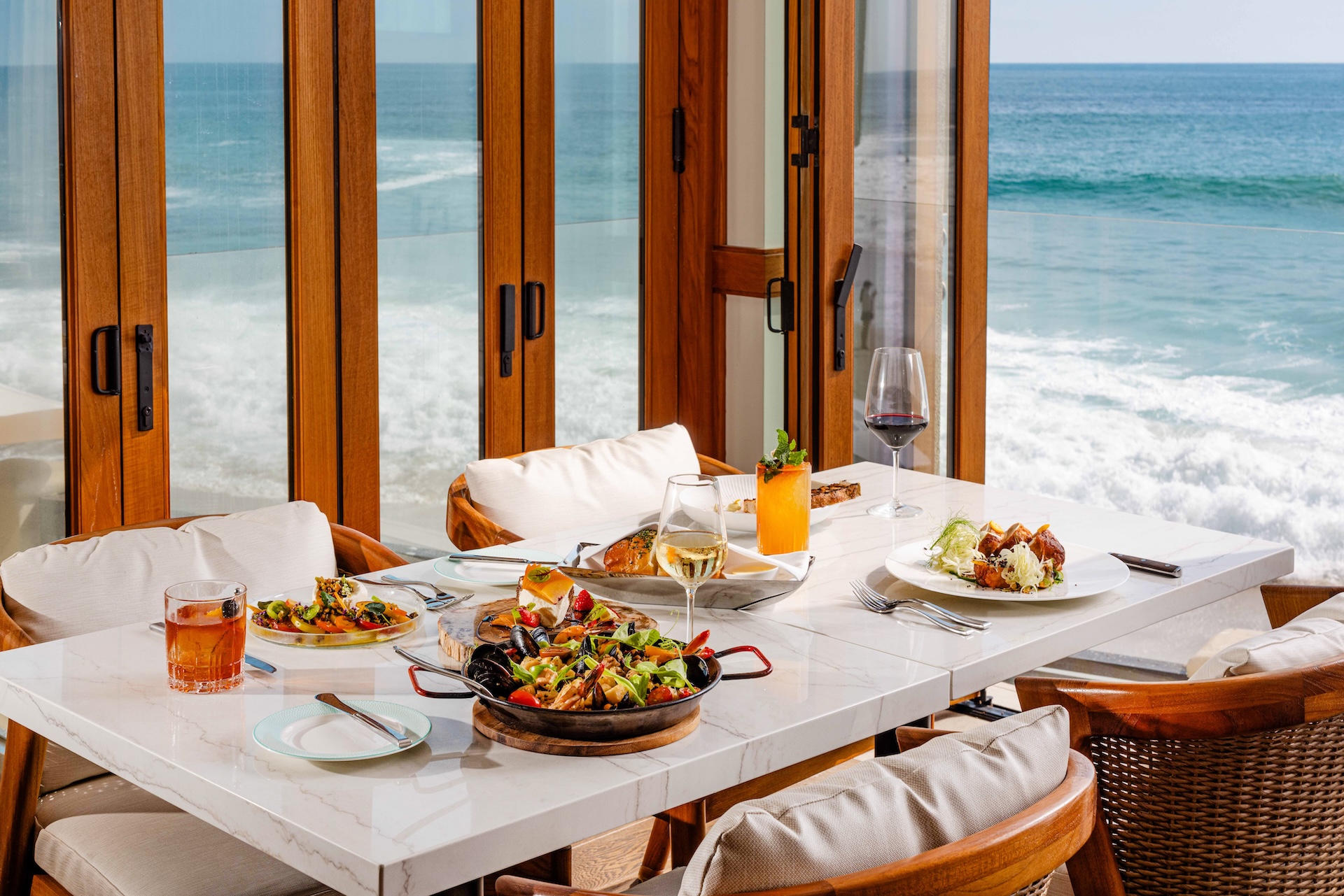 a table with food on it and a glass of wine on it