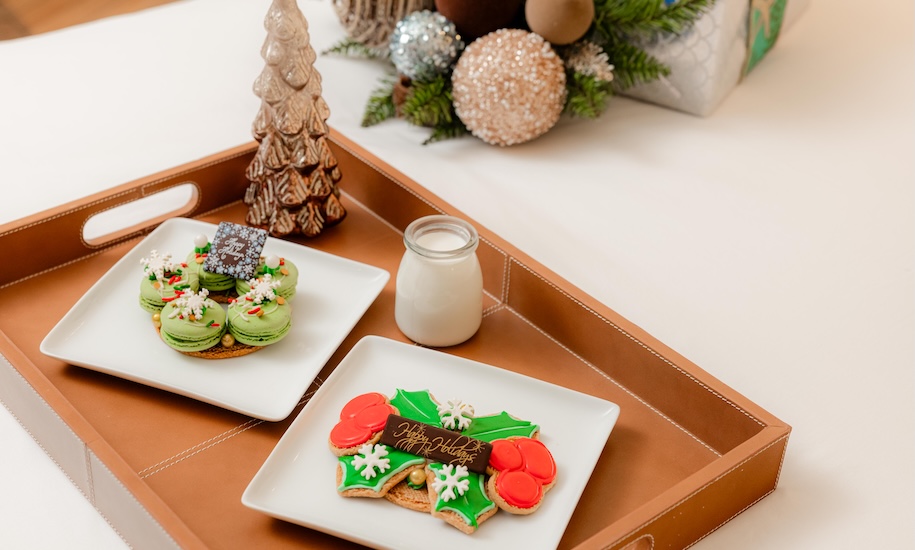 a tray with cookies and a bottle of milk