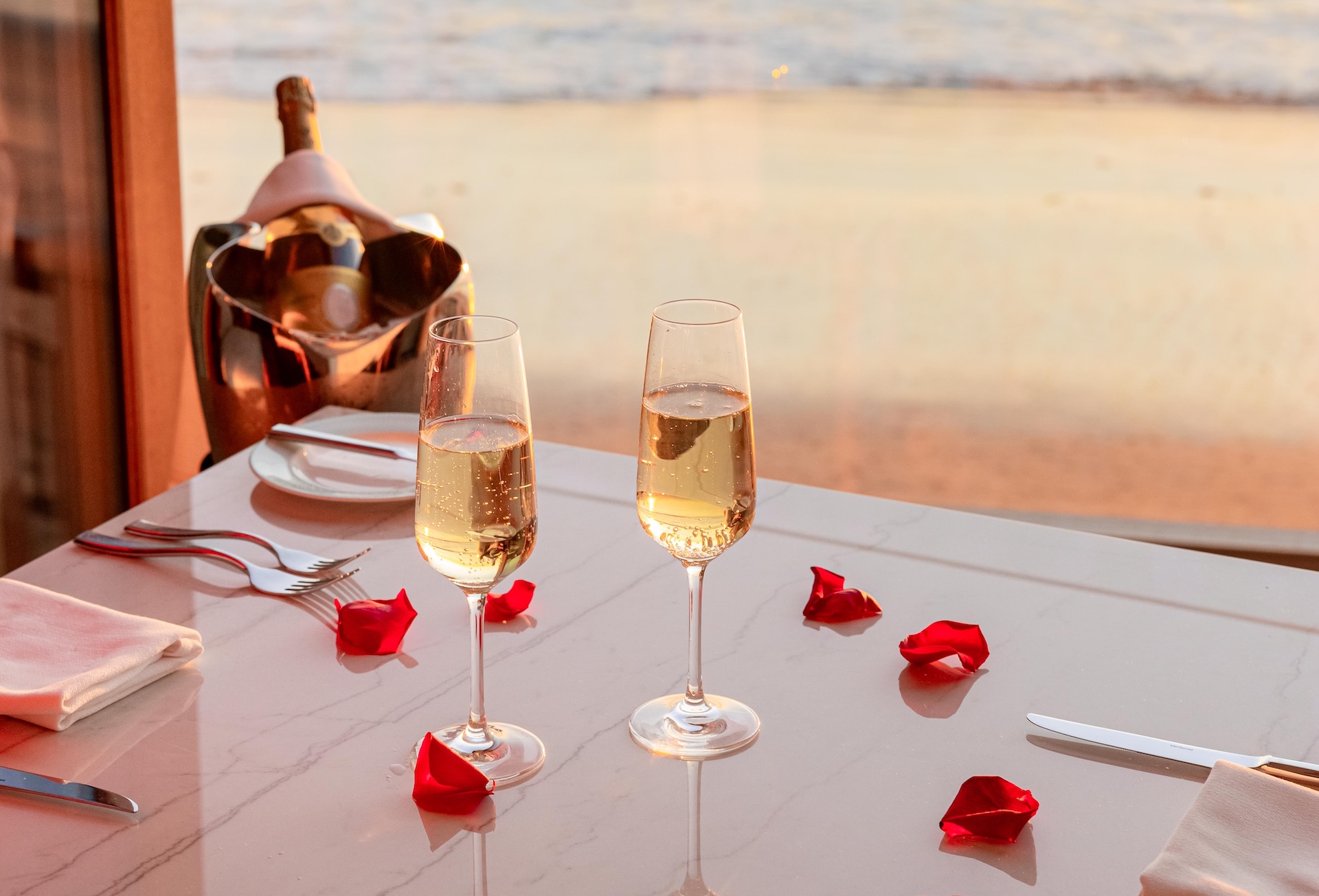 two glasses of champagne on a table