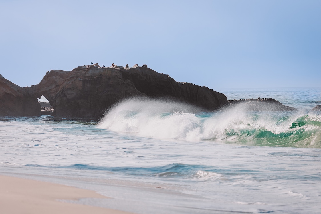 waves crashing waves on a beach