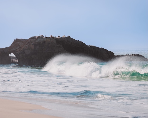 waves crashing on a rock