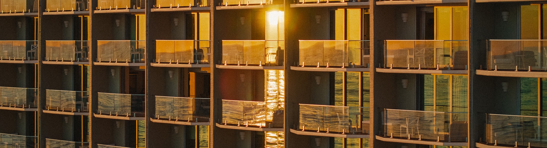 a building with glass balconies