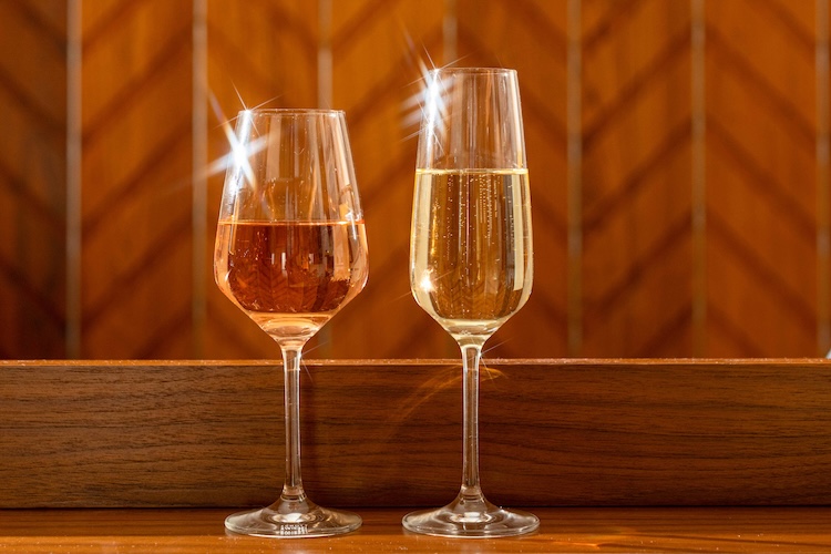 two glasses of wine on a table