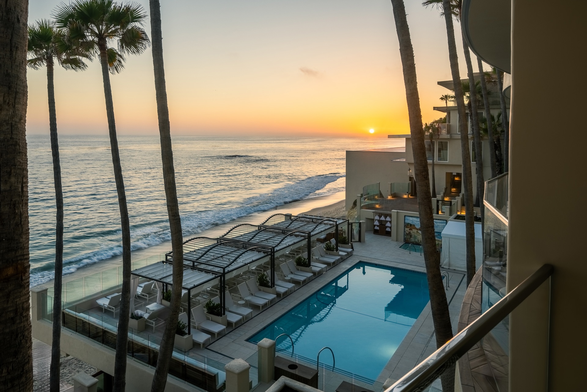 a swimming pool next to a beach