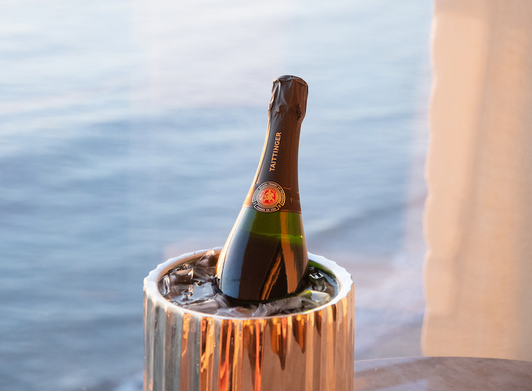 a bottle of champagne in a bucket of ice
