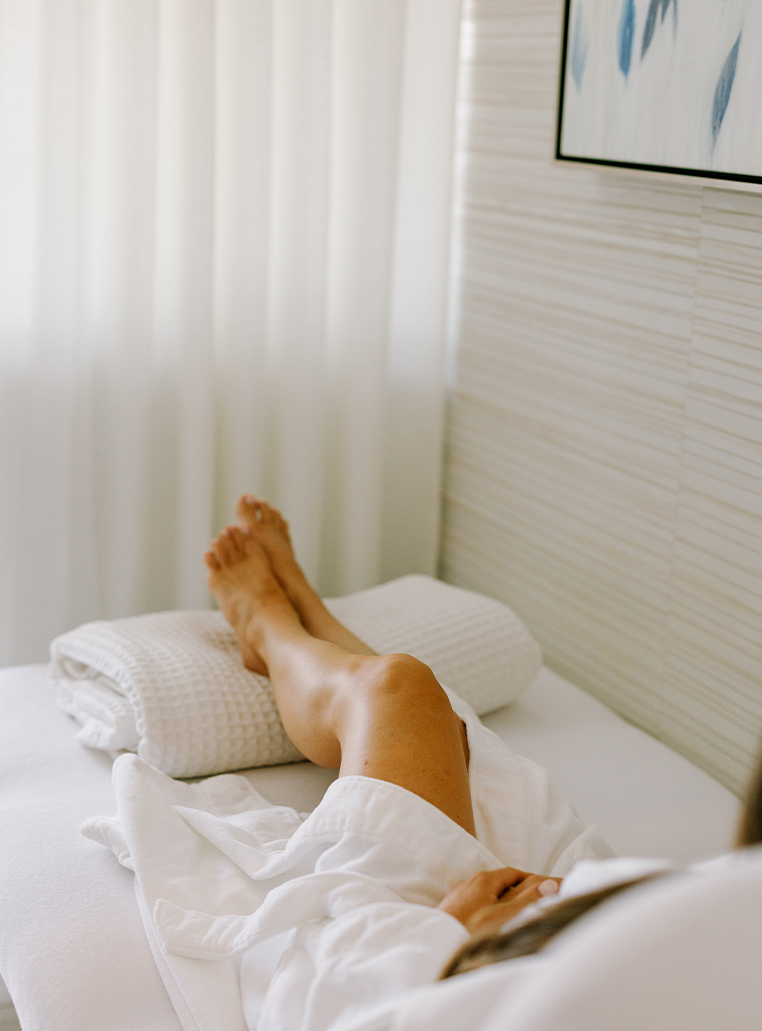 a person's legs on a bed