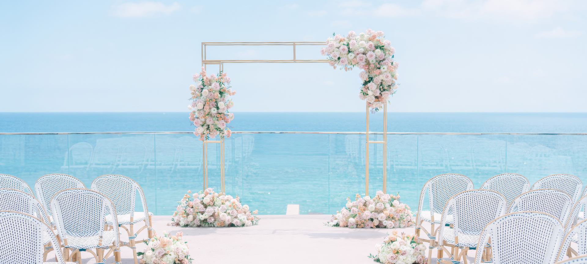 a wedding ceremony with flowers and chairs