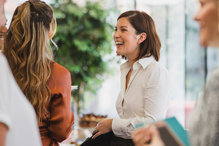 two women talking and laughing
