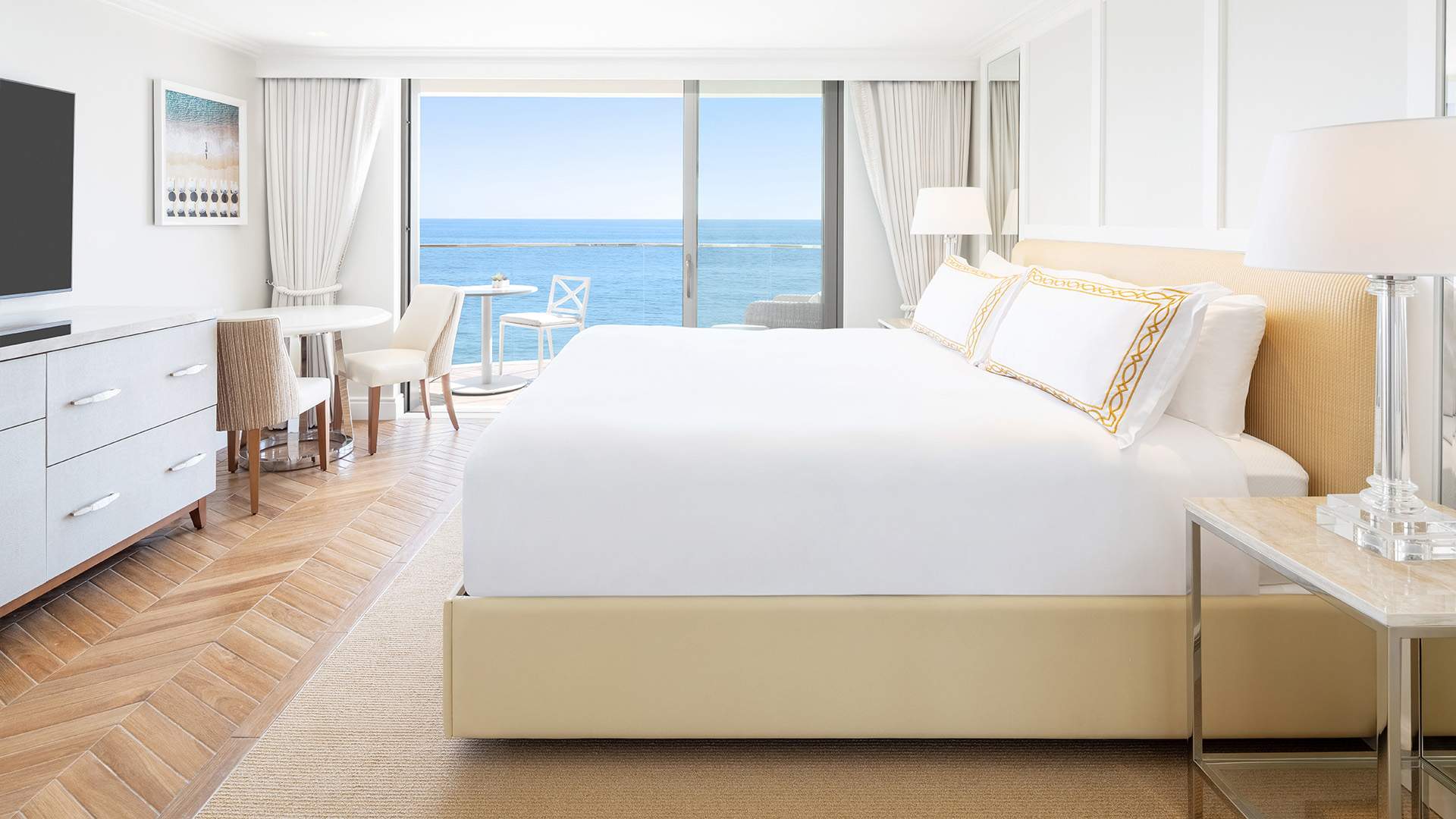a bed with a view of the ocean