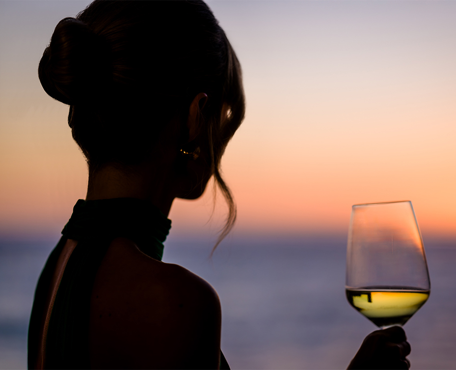 a woman holding a glass of wine