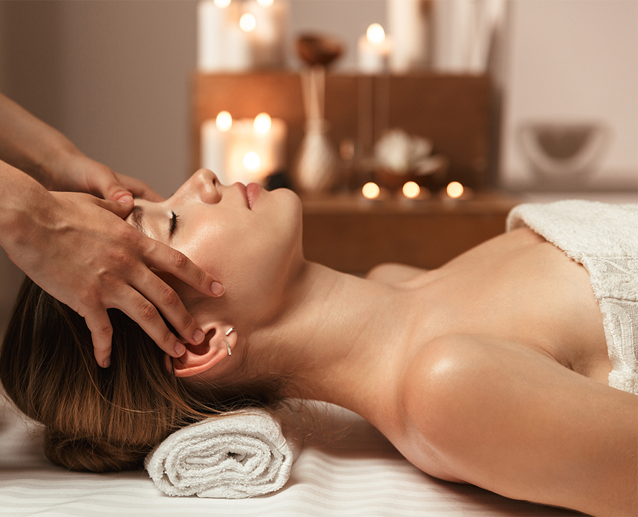 a woman lying down on a massage table