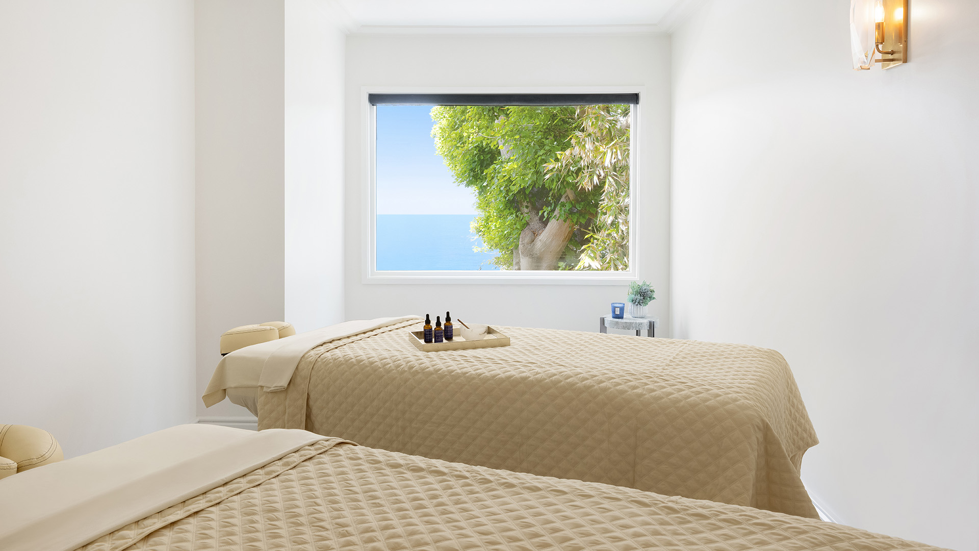 a room with two beds and a window