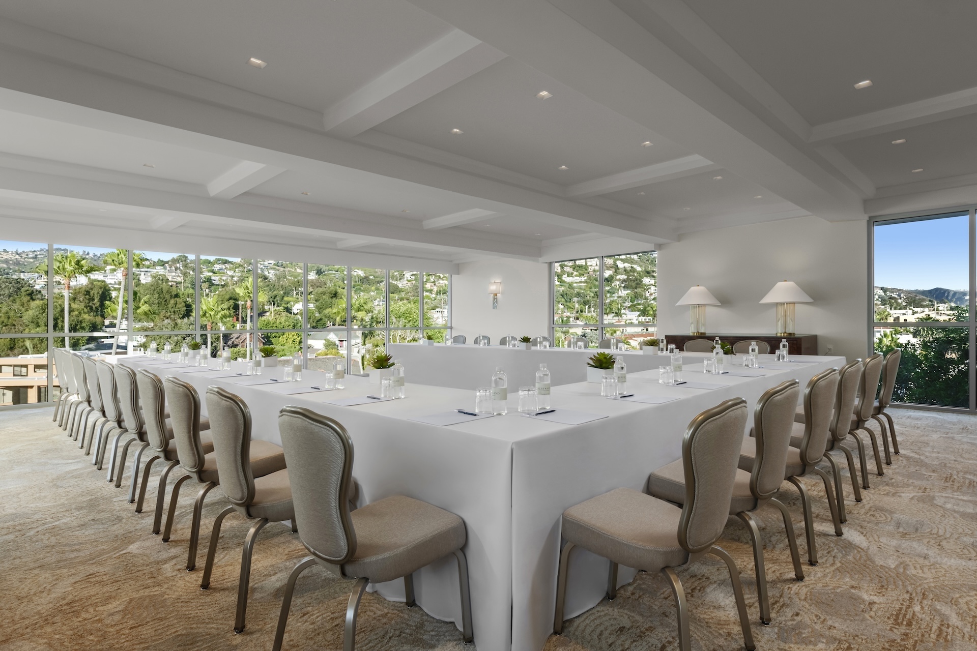 a large conference room with a long table and chairs