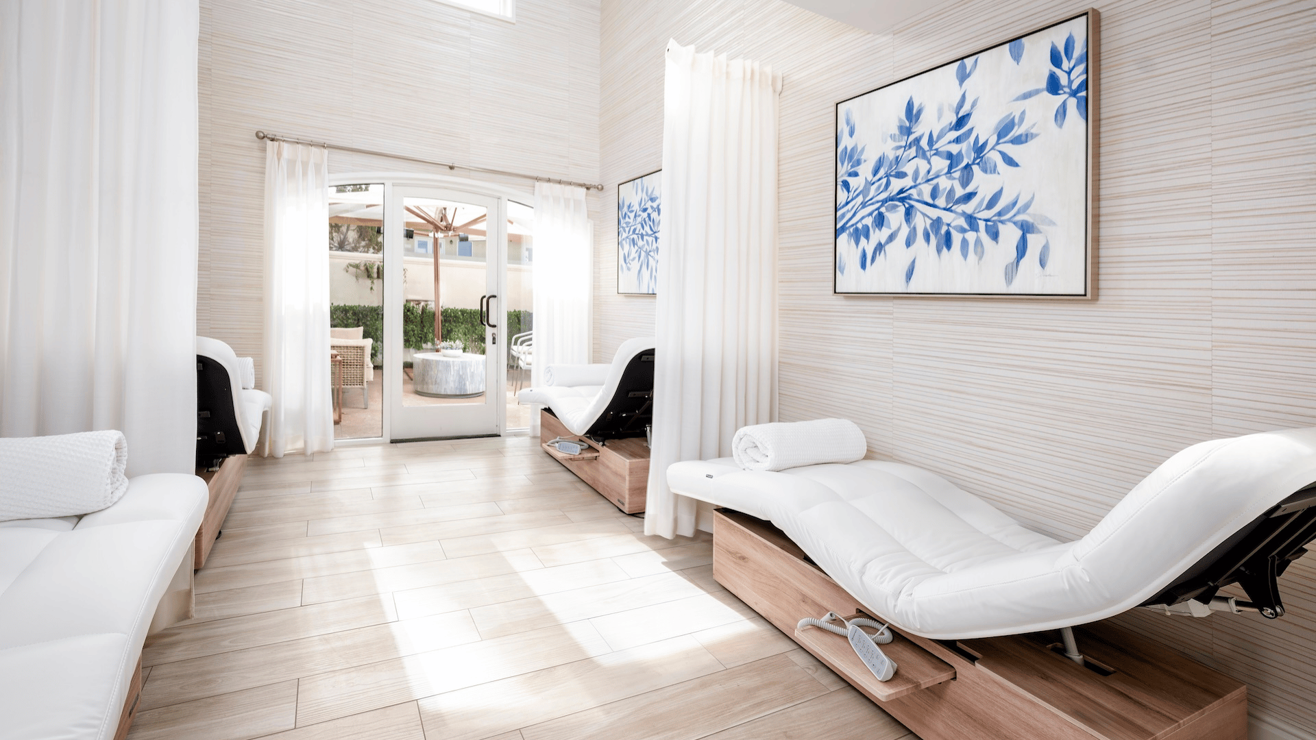 a room with a couch and a glass door
