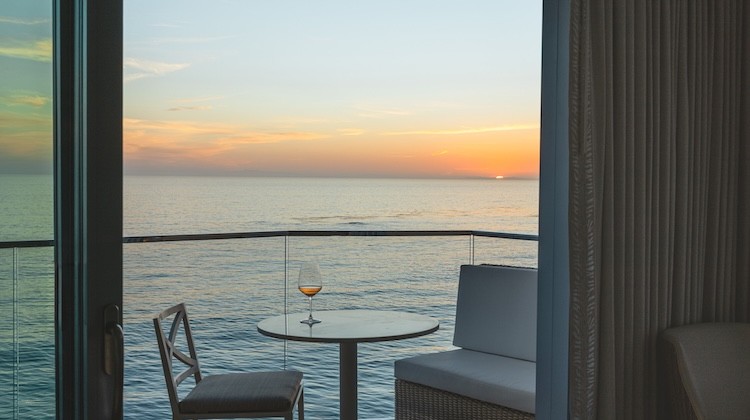 a table and chairs overlooking the ocean