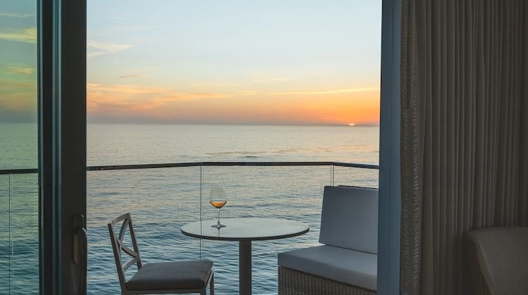a table and chairs overlooking the ocean