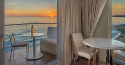 A table and chairs next to a window
